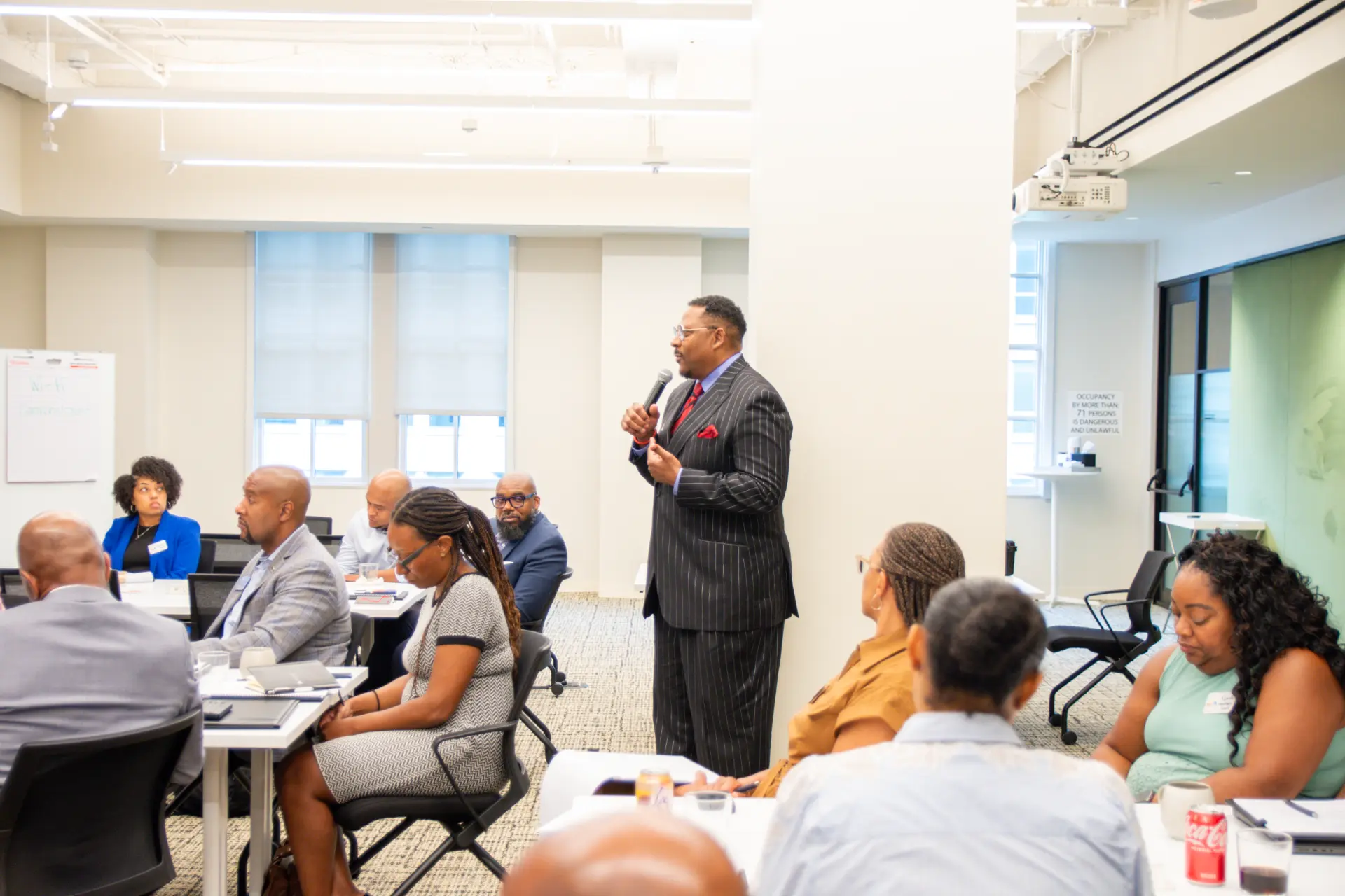 Galen Bingham delivering a keynote to a room of senior executives