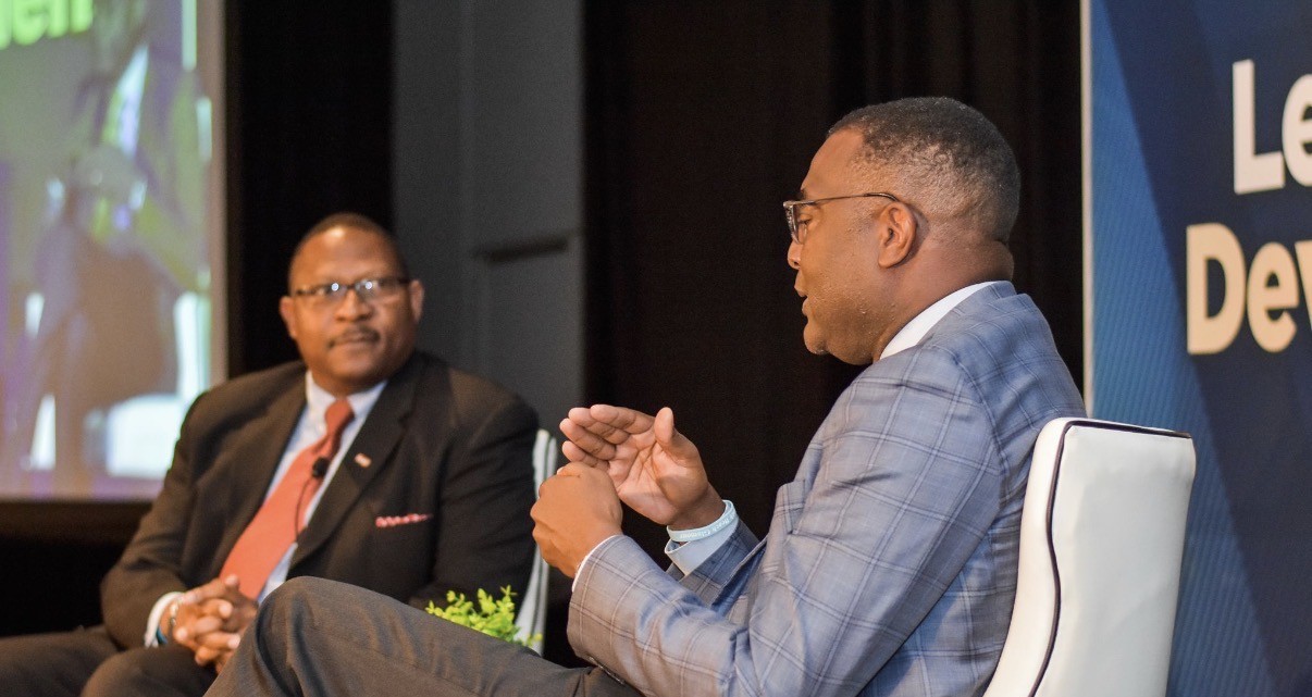 Galen Bingham in an executive fireside conversation on stage during a leadership development event